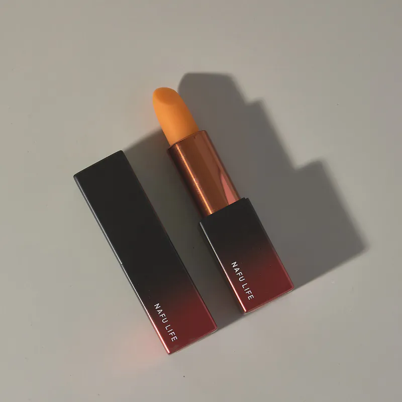 NAFU LIFE Asta-S Tinted Lip Balm and cap photographed at an angle